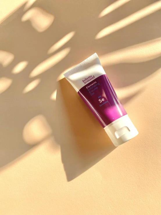 a tube of sunscreen sitting on a surface