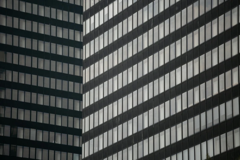 a black and white tall building with many windows