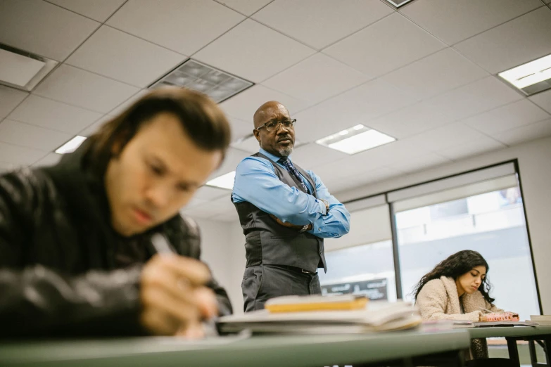 a man and woman doing their homework at the desk