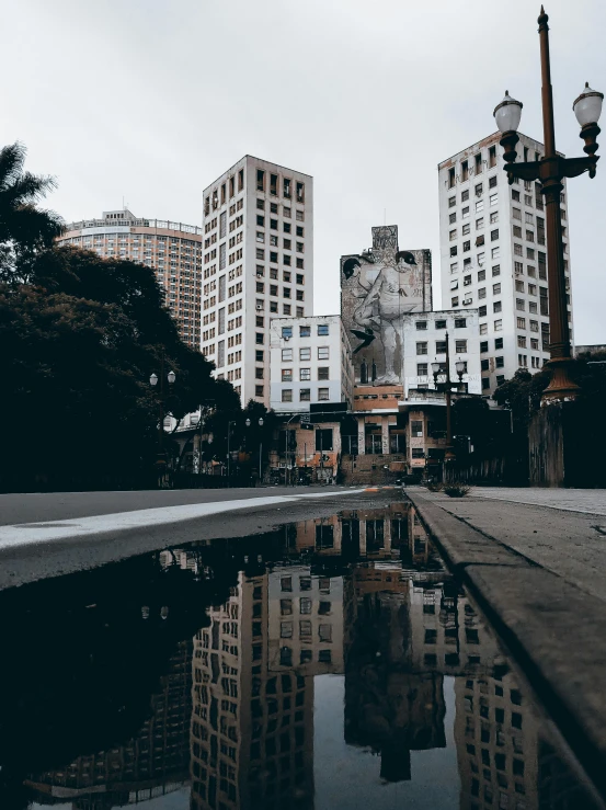 a pond in the middle of some buildings