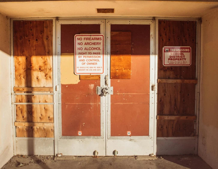 the door to a building that has a wooden door