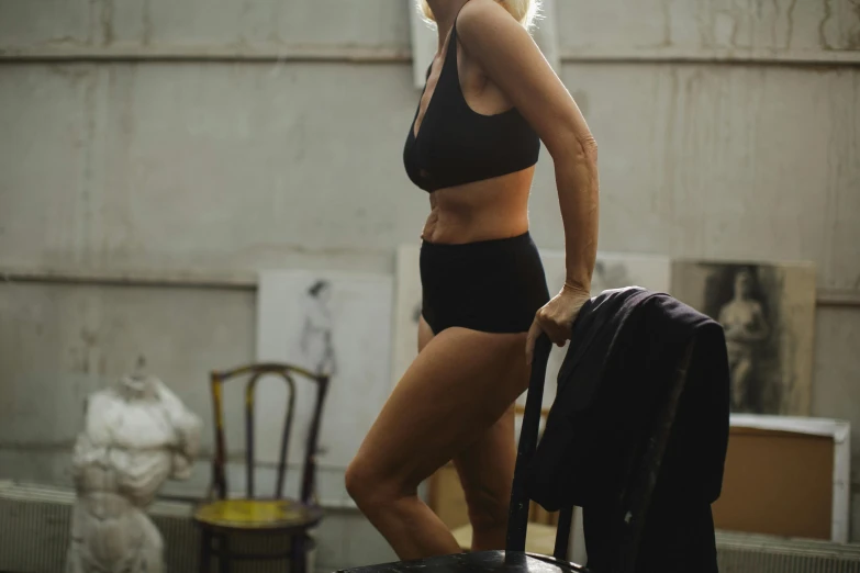 a woman standing on the roof with luggage