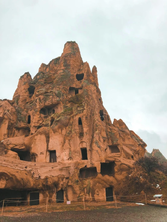 several houses built into the side of a rock formation