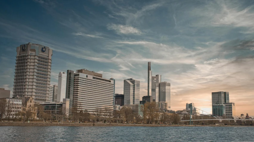 a body of water near a group of tall buildings