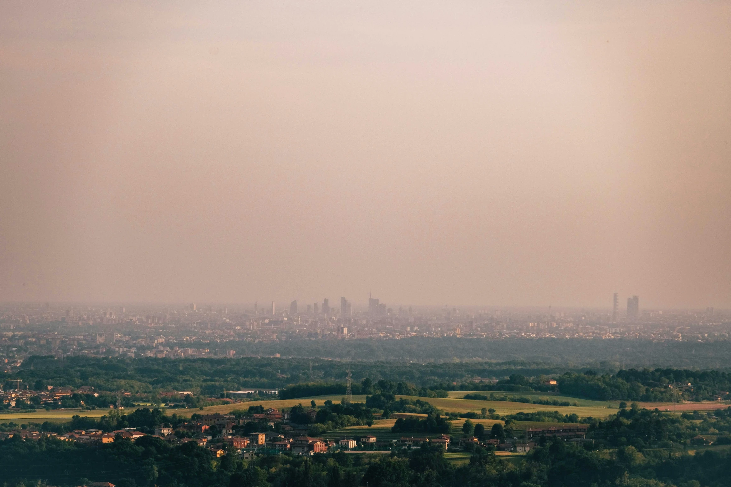 a view over the town of city from the hilltop