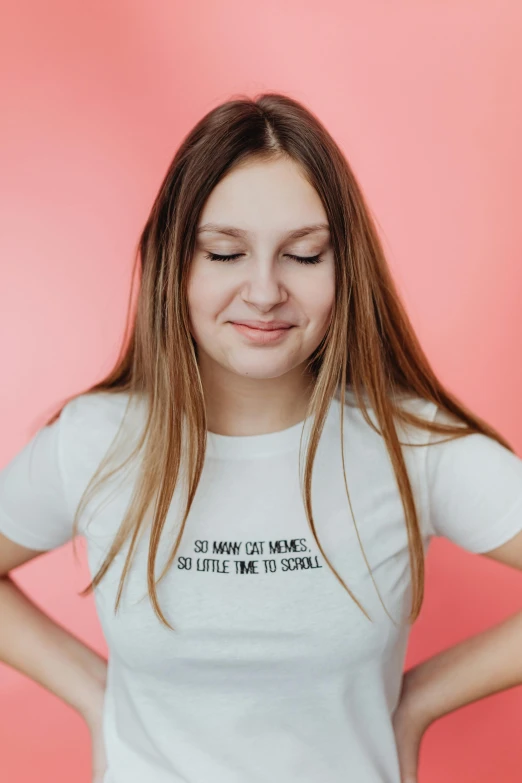 girl in white t shirt with message saying on chest