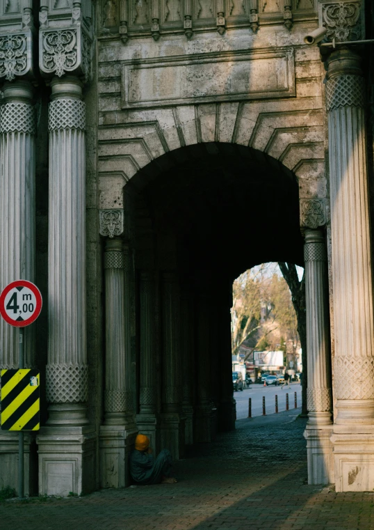 the gate to the tunnel has a sign in front of it