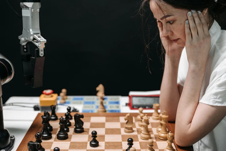 a person is playing chess in a room