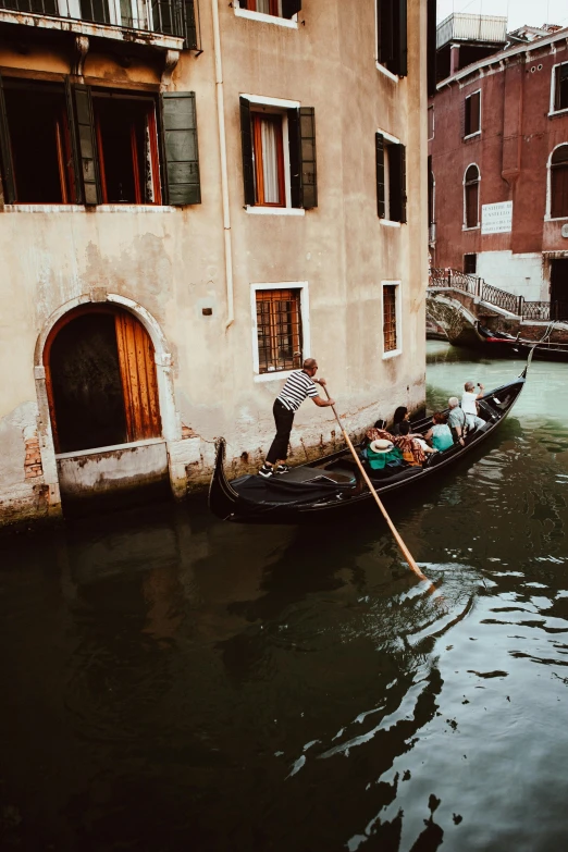 a group of gondolas are parked next to buildings