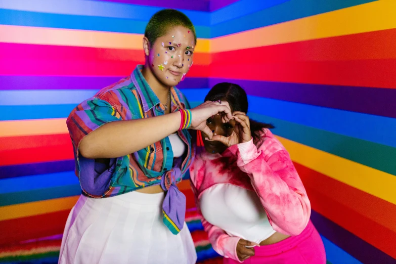 two woman in brightly colored art studio setting