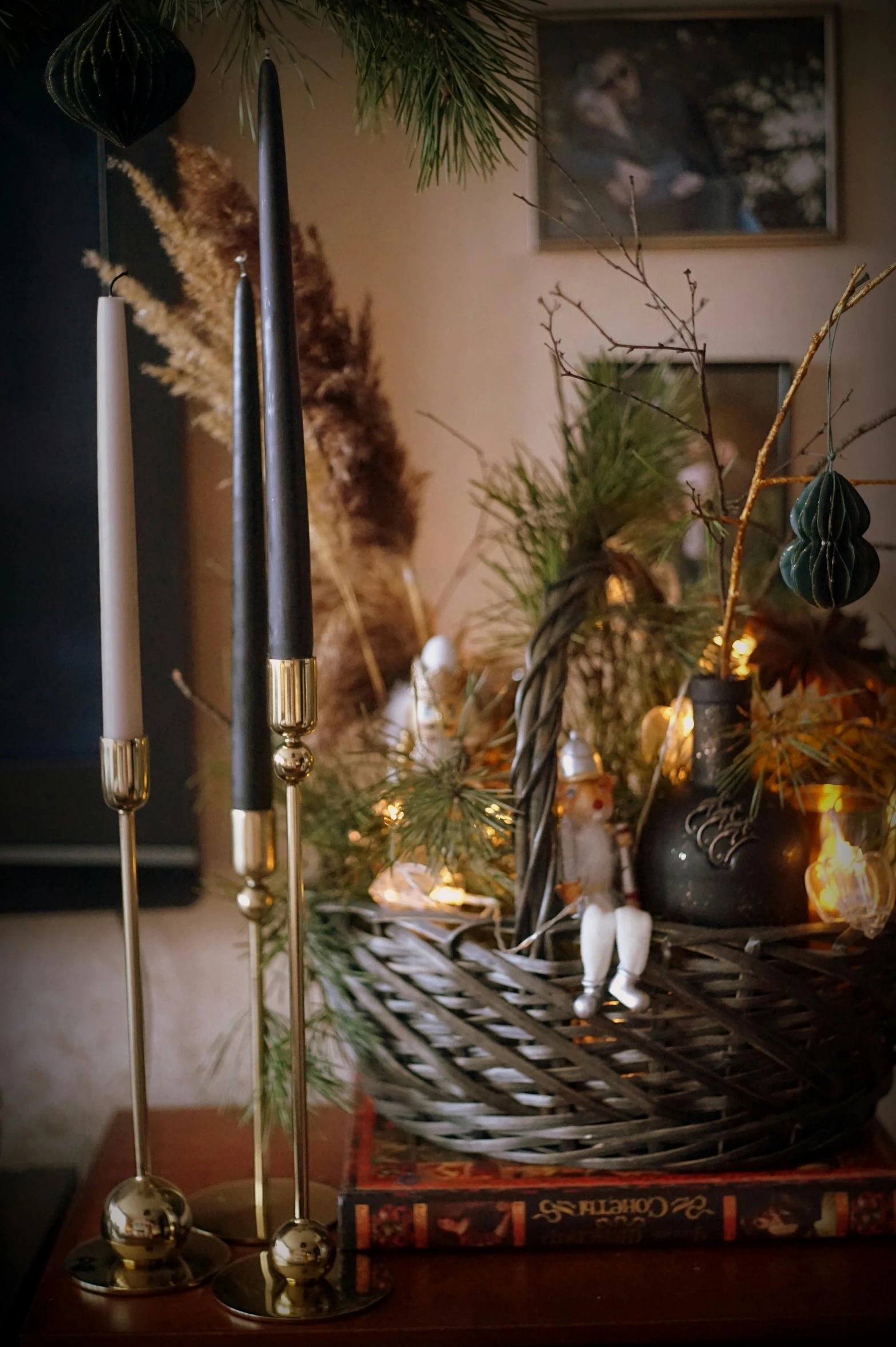 a display of candles and christmas decorations on a table