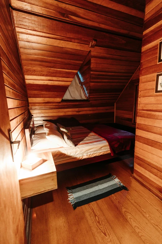 a bed room with a wooden wall and carpet