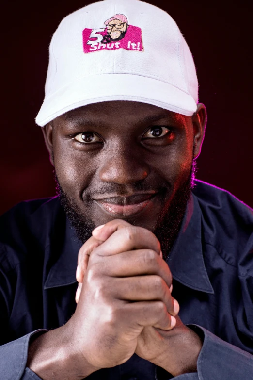 an african american man wearing a white hat