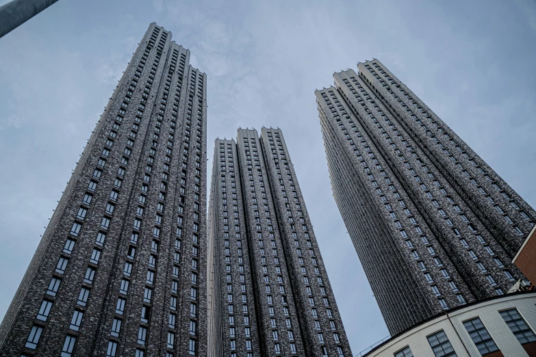 two tall buildings on the top floor of a large building