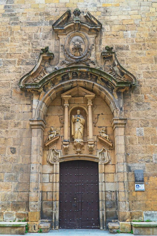 a large brick building with a wooden door