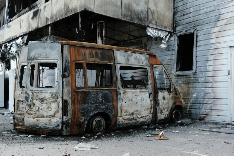 a bus parked in front of a run down building