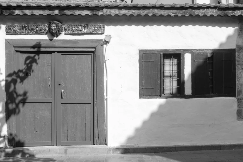 black and white pograph of a door and window