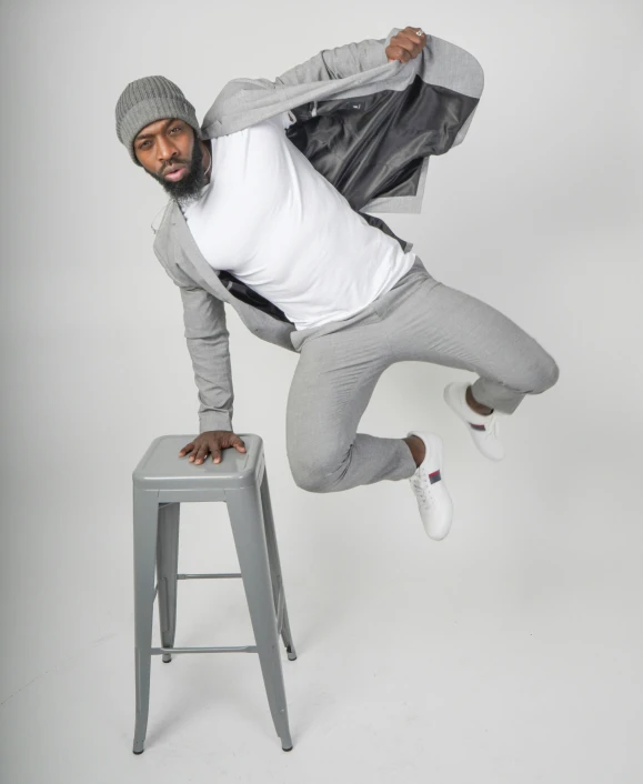 a man is doing a dance move while jumping