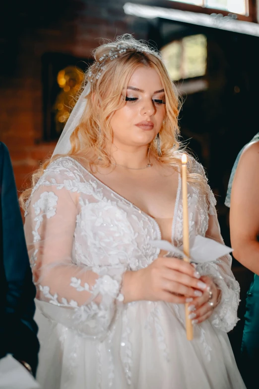 a very cute young lady in her bridal gown