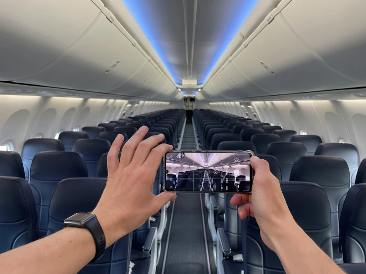 the interior of an airplane is equipped with many different seat styles