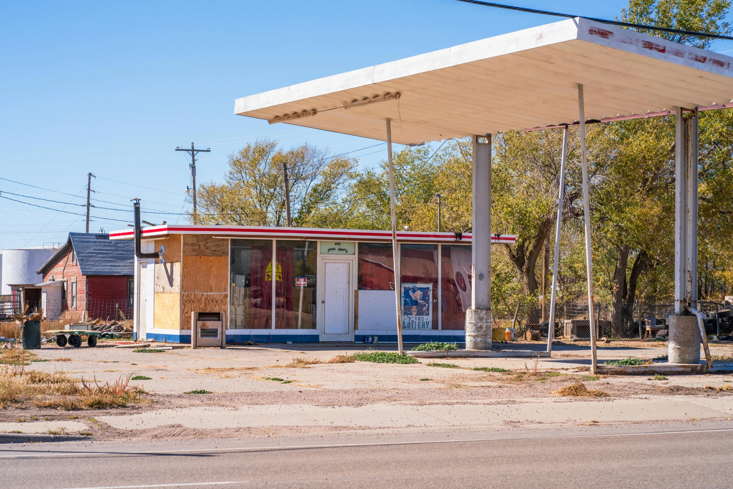 an abandoned gas station with multiple items