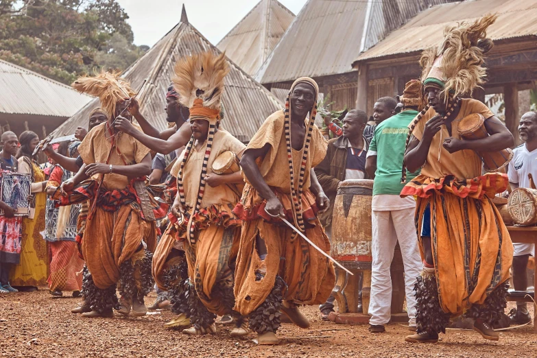 a group of people are performing their dances outside