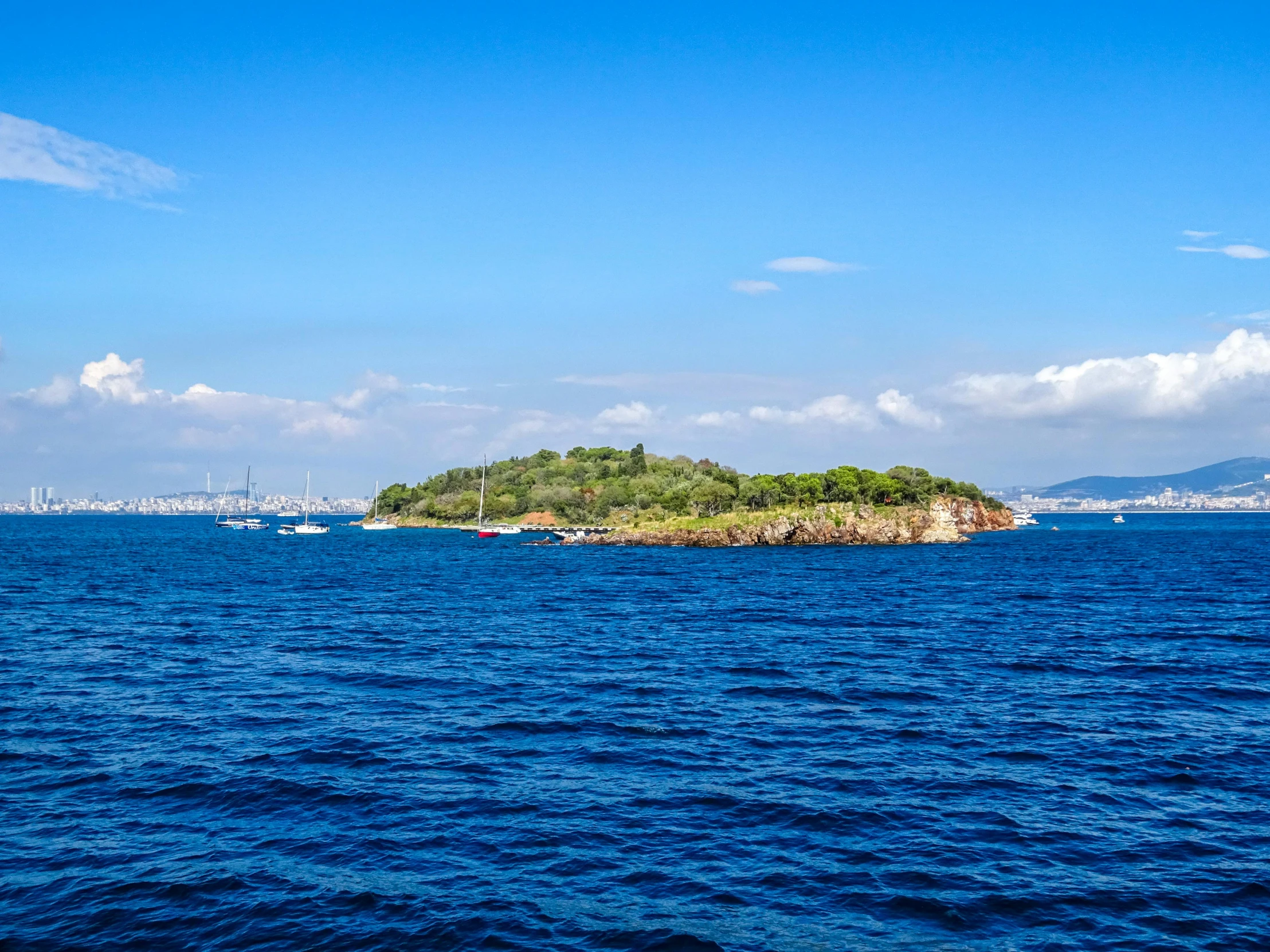 a small island sits on a body of water