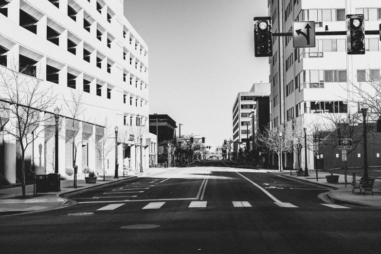 a road in the middle of two buildings