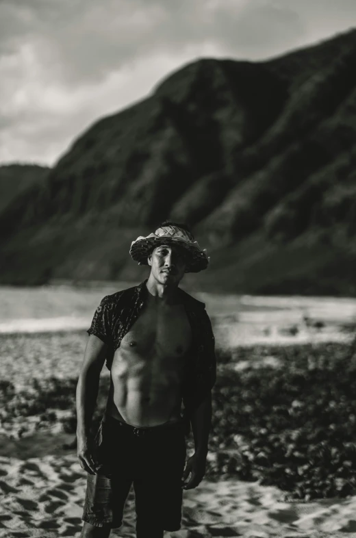 a man standing on top of a rocky beach