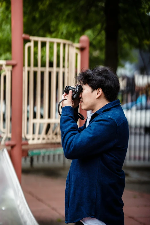 a young lady that is taking pictures of soing