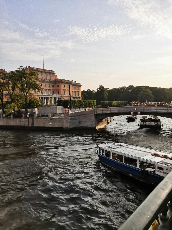 boats are seen in the water as they travel down the river