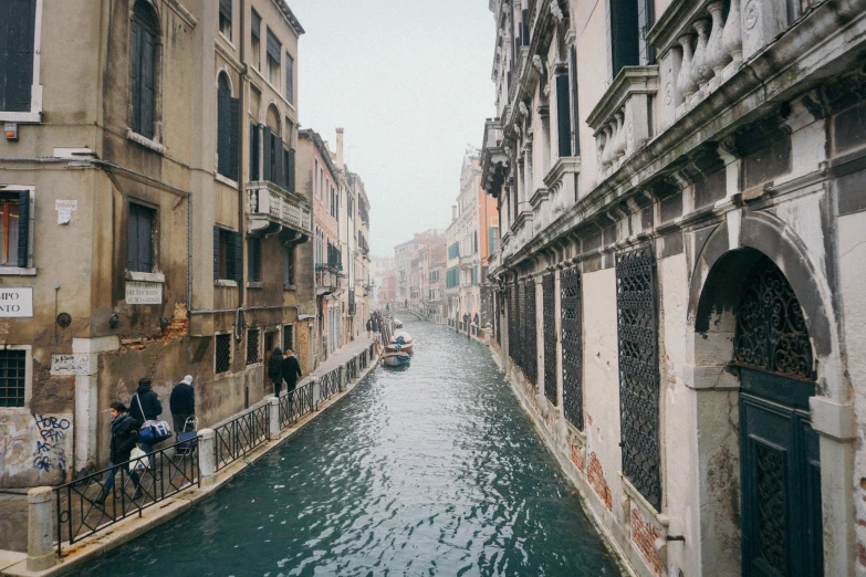 a canal is running through the city next to several buildings