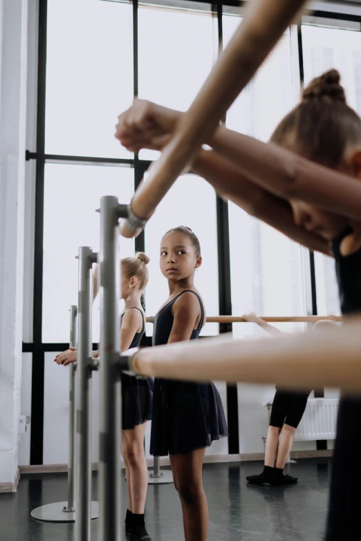 a  practicing ballet in a large room