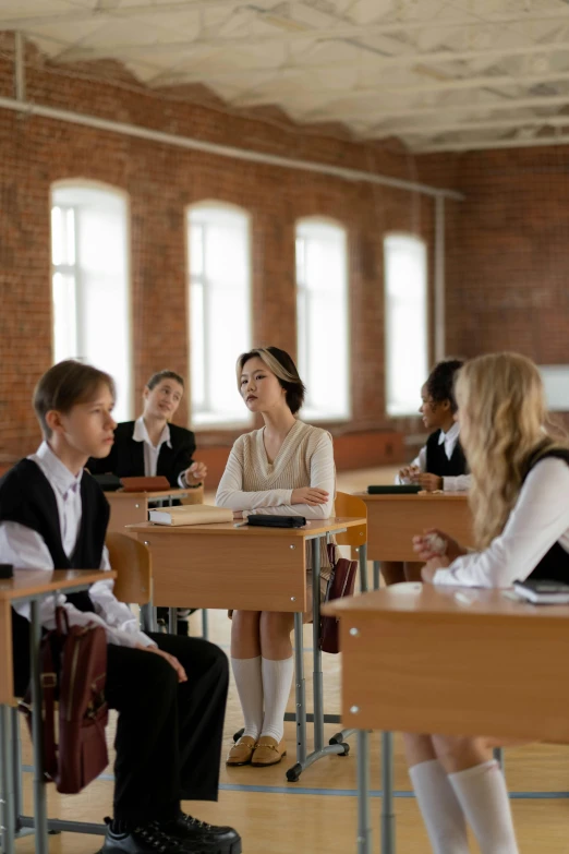 a group of students in a classroom with two girls