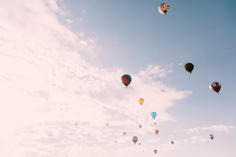 a group of balloons flying in the air