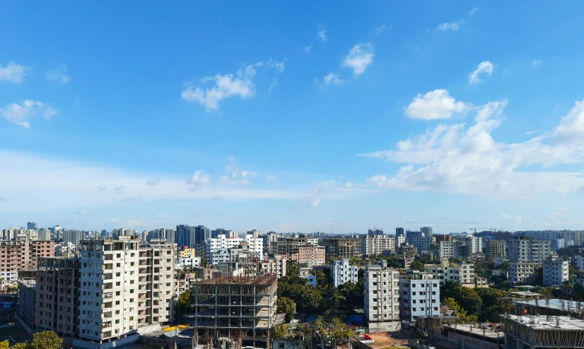 a city with buildings under a partly cloudy sky