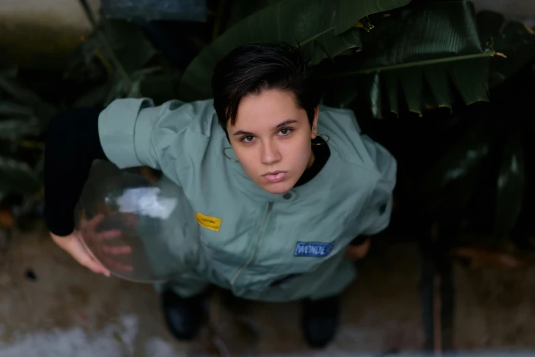 the young person in a uniform has her hands in his pockets