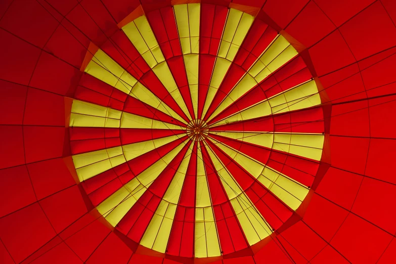 a red and yellow ceiling inside a large building