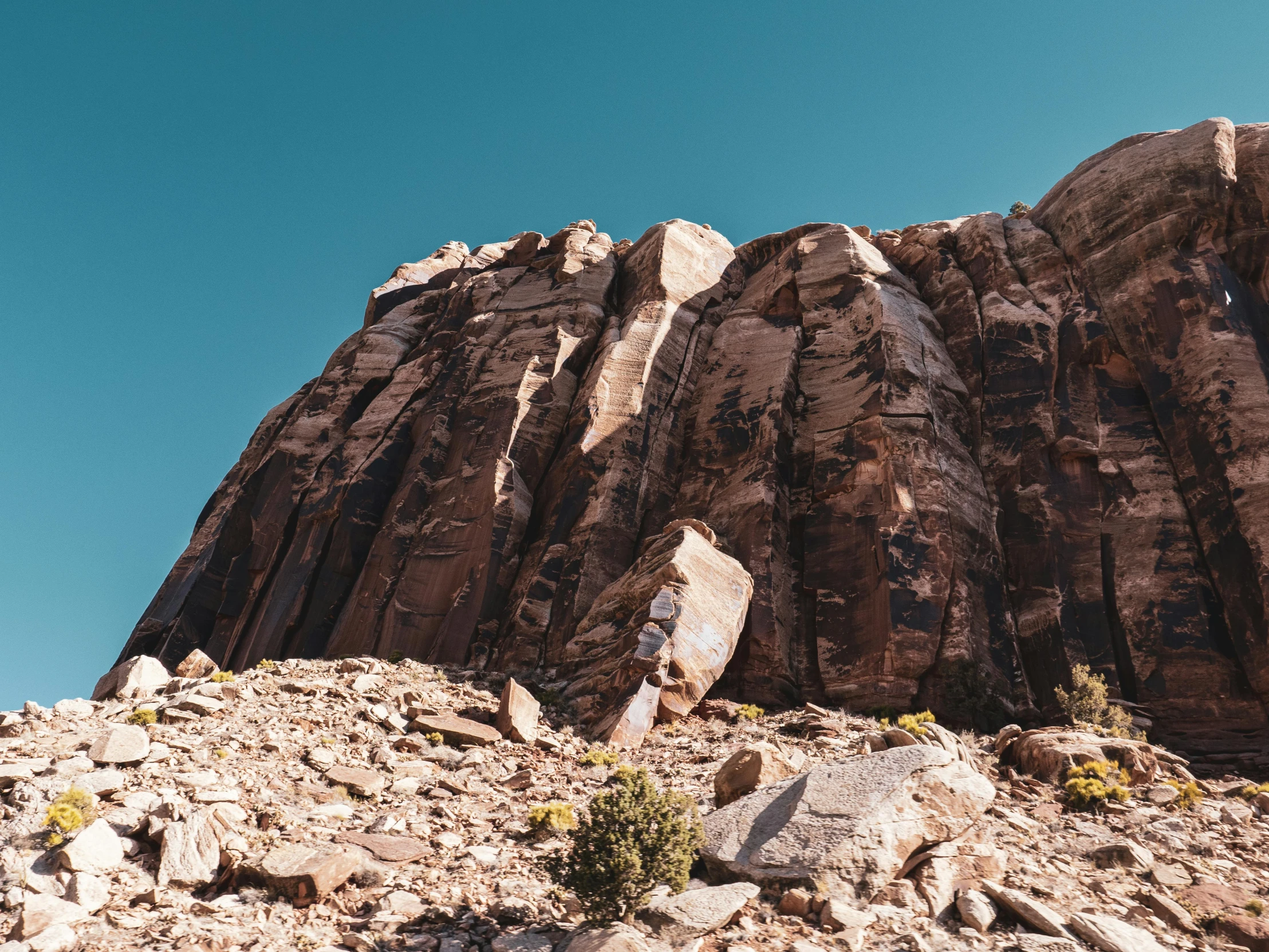 a mountain with some rocks in front of it