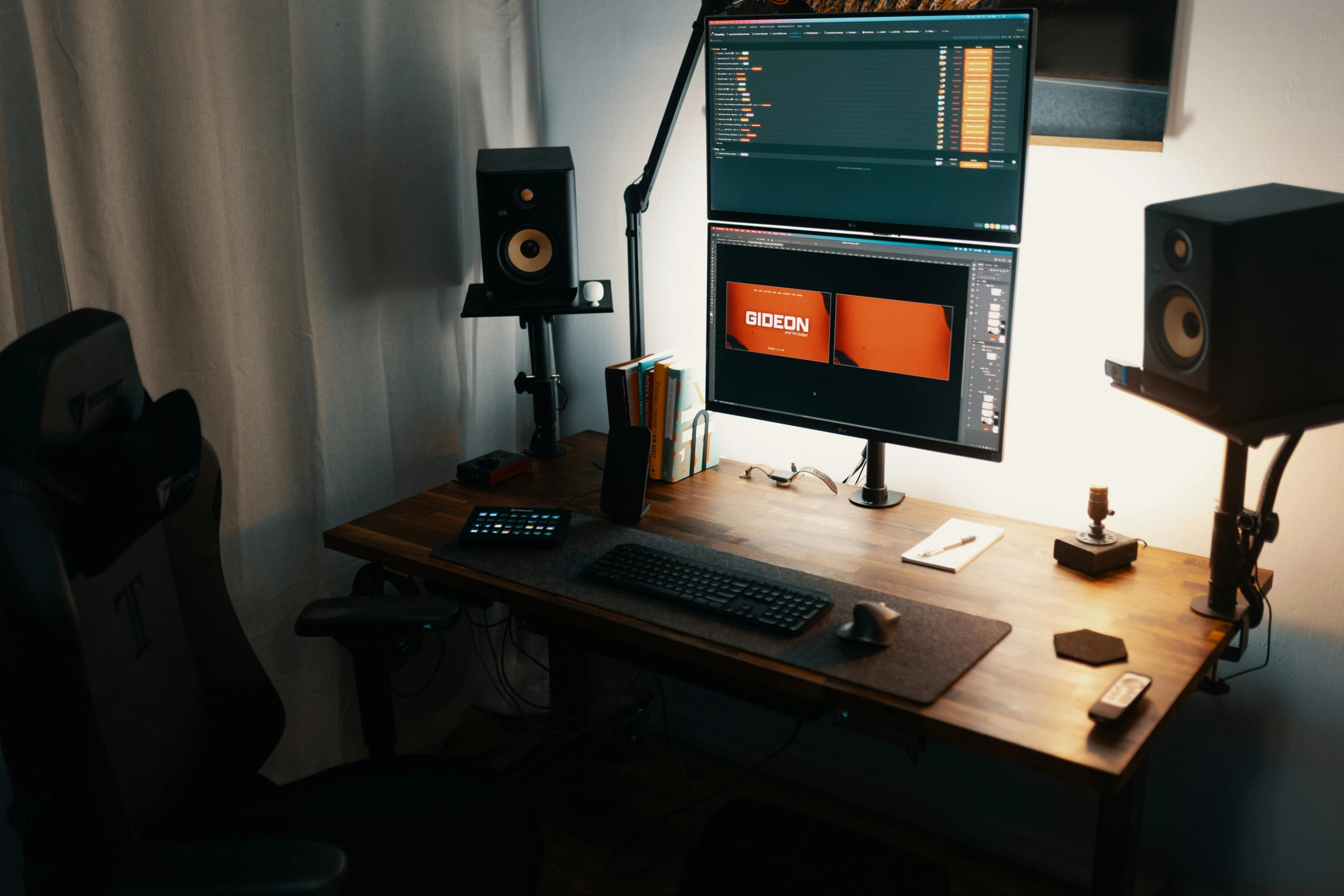 computer with keyboard, speakers, and monitor on desk in room