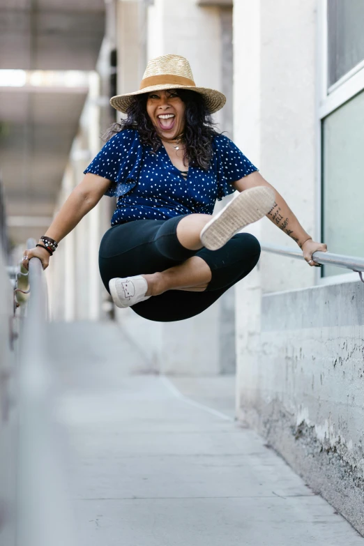 a person jumping on the side of a railing