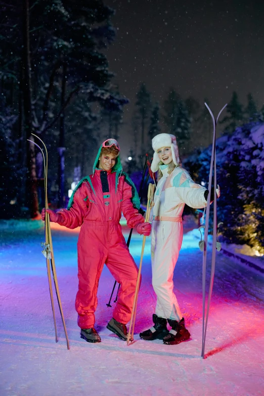 two men standing together in snow gear