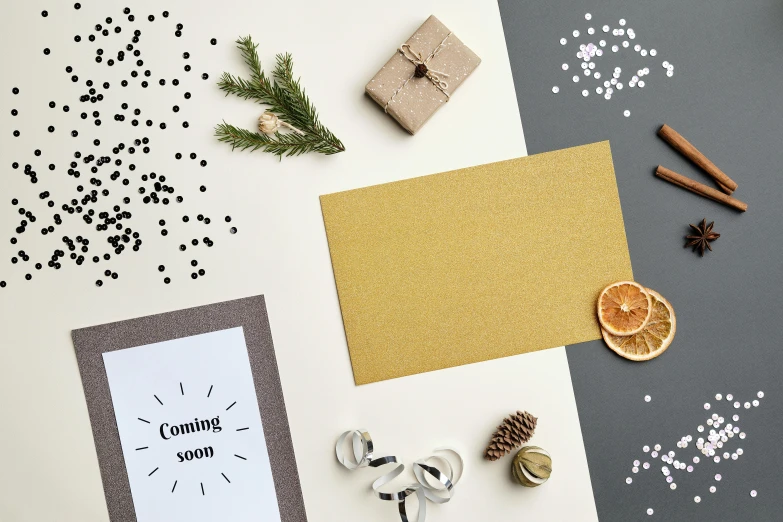 a card on top of a greeting card surrounded by christmas decorations