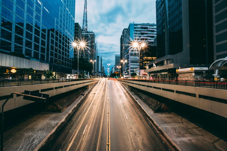 view of city skyline with very long and busy road