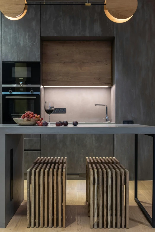 modern kitchen area with dark wood furniture and lights