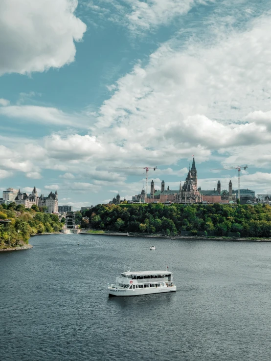 a boat sailing down a river in a city