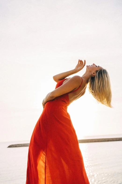 a woman standing on her knees and looking up