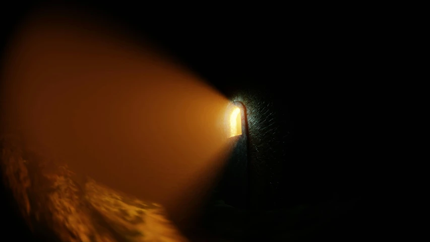 an image of light coming out from behind a window in a cave