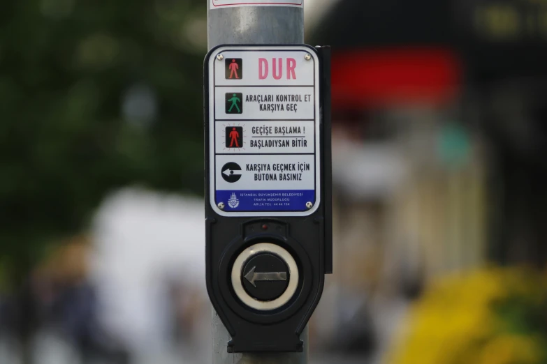 a street sign on a pole on a sidewalk