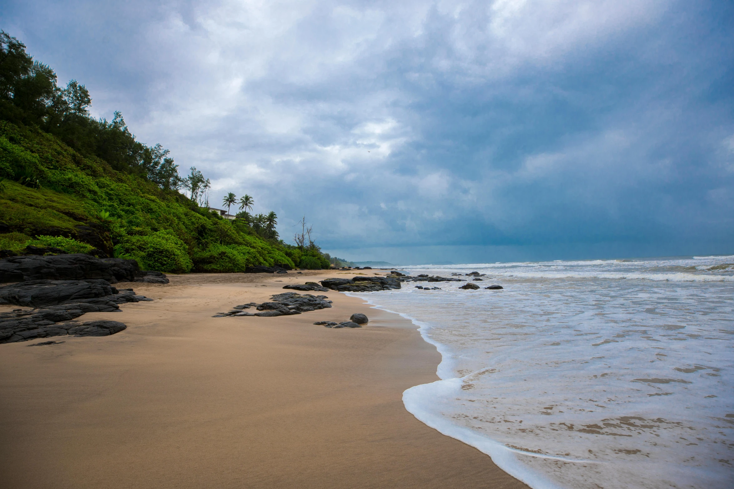 a very sandy beach next to some water